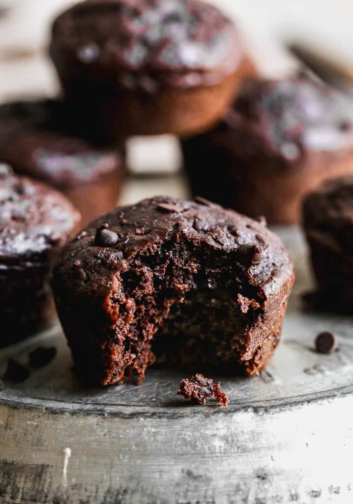 chocolate muffins sitting on top of a metal tray