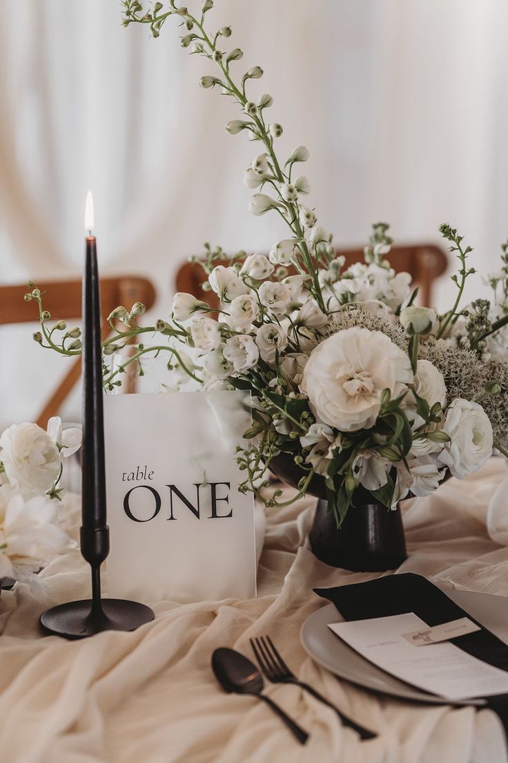 Frosted acrylic wedding sign with black taper candles and white wedding flowers for table decoration Wedding Decor Black And White, Neutral Wedding Color Palette, Wedding Decor Black, Flowers For Table, Black Wedding Table, Wedding Color Palette Ideas, Black Wedding Decorations, Black Taper Candles, Monochrome Weddings