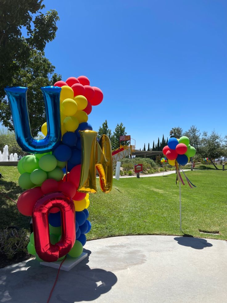 an inflatable balloon sculpture with the word love spelled out