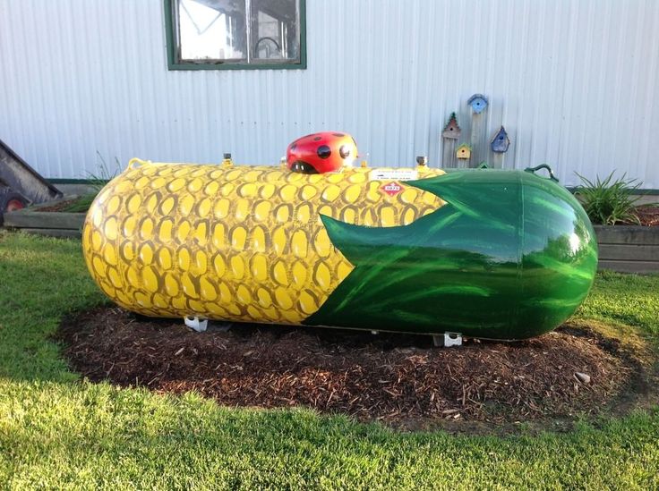 an inflatable corn on the cob with a ladybug sitting on top