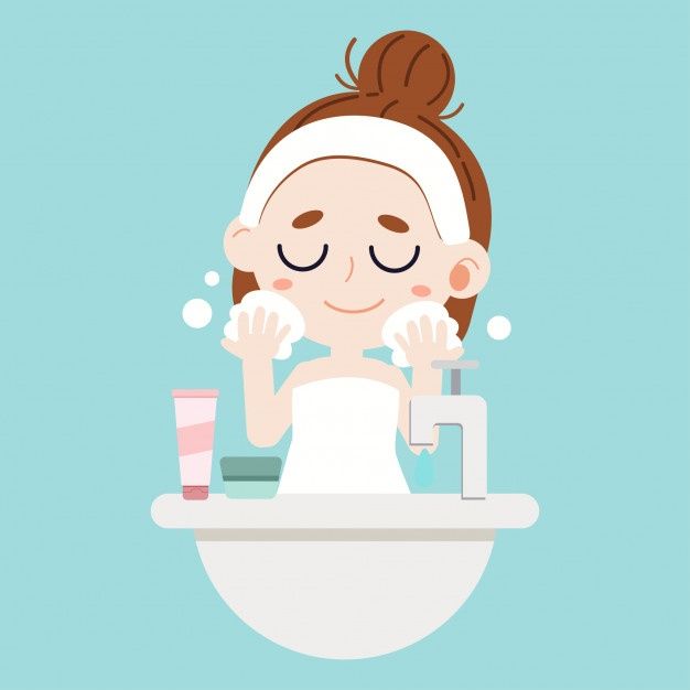 a woman is washing her face with soap on top of the toilet in front of a blue background