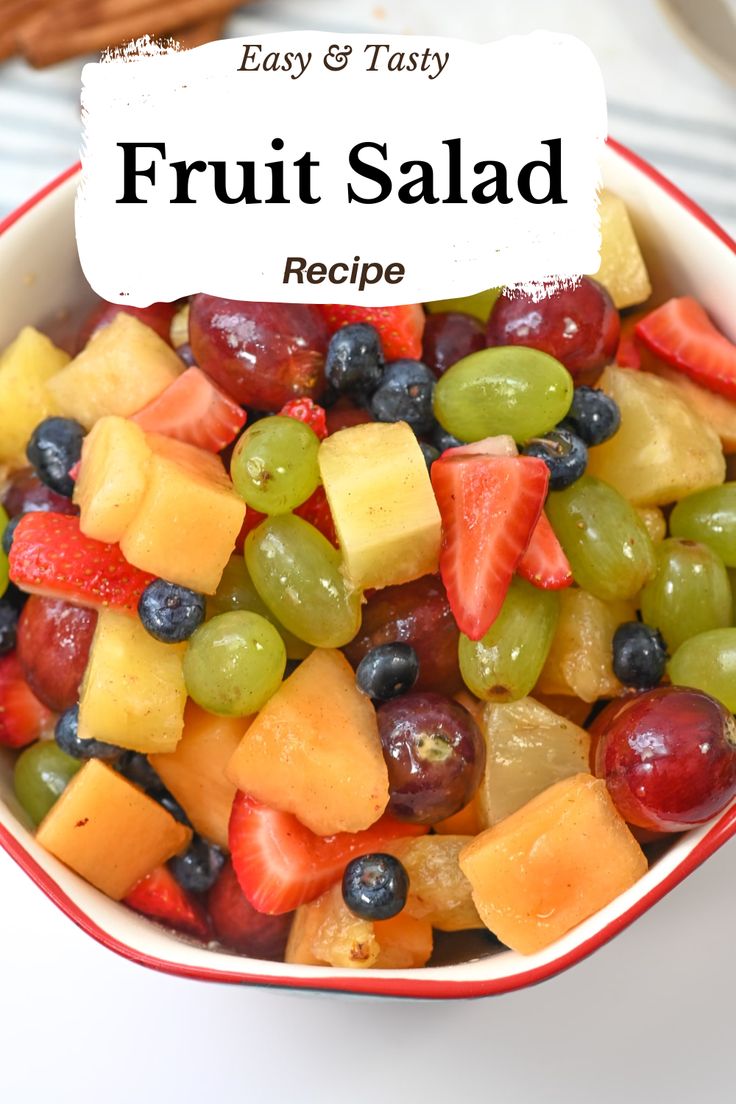 a bowl filled with fruit salad on top of a table