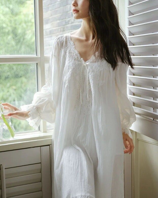 Are you in search of exquisite, high-quality sleepwear? Look no further than the Women Fairy Pure Cotton Puff Sleeve Robe Double Layers Long Night Dress. Crafted from soft and luxurious material, this nightdress complements any body type with its beautiful design. The vintage lace V-neck adds an elegant touch, while the Victorian-inspired nightgowns and nightwear bring a unique flair to your wardrobe. Versatile enough for sleepwear, loungewear, home attire, or casual wear, this nightwear not onl Vintage Princess Dress, Cotton Night Dress, Victorian Nightgown, Night Gown Dress, Vestidos Retro, Edwardian Dress, Vintage Nightgown, Blue Night, Vintage Princess