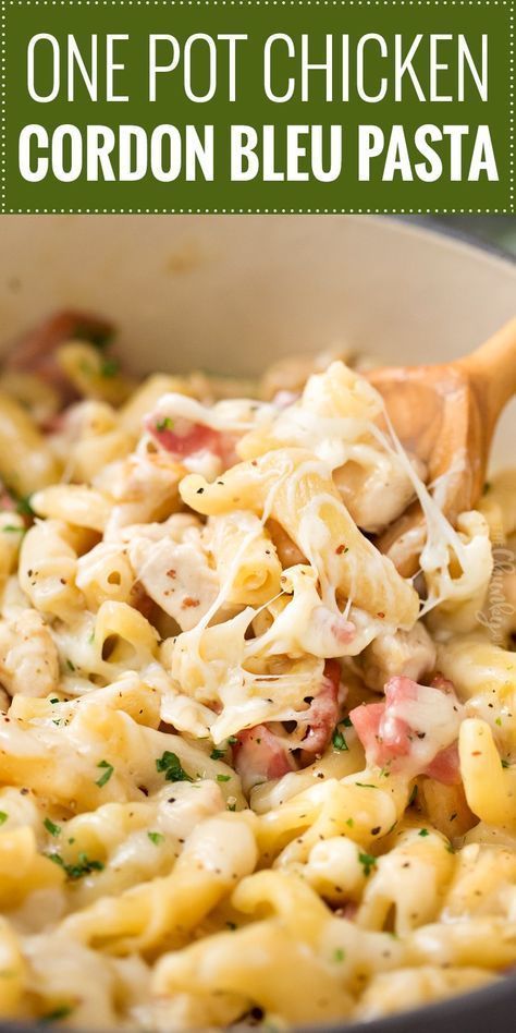 one pot chicken cordon bleu pasta in a pan with a wooden spoon