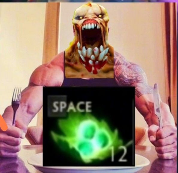 a man sitting at a table in front of a plate with an evil face on it