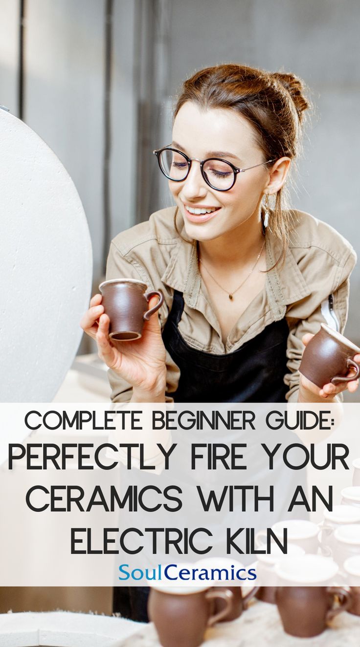 a woman holding two cups and smiling with the words, complete beginner guide perfectly fire your ceramics with an electric kiln