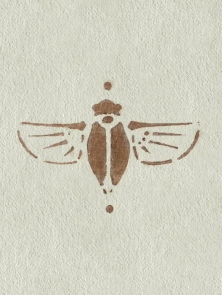 a drawing of a bug on a piece of paper with some brown ink in it