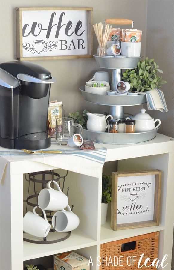 a coffee bar with cups and plates on it