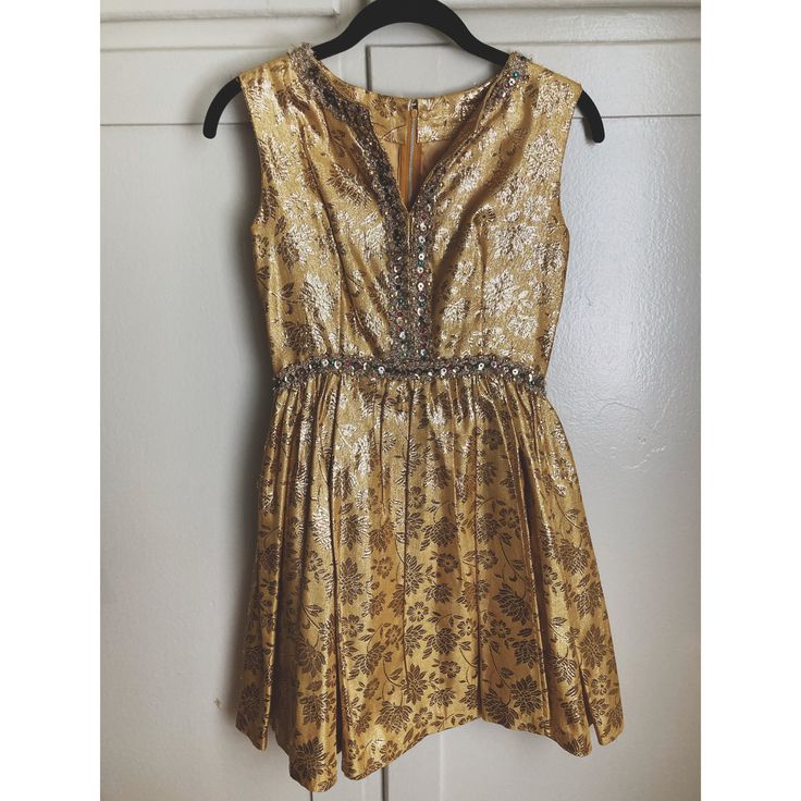 "One of a kind vintage 50's/60's Gold & Silver foiled mini party dress. It has no tag or label and looks to be handmade. Freaking amazing. Shiny foiled gold with silver leaf and flower design. Red, green, yellow and gold bejeweled accent along waist and up to the neckline. Zip up back. Very fitted chest that billows out at the waist. Extremely flattering and stand out piece.  Party dress and conversation piece. Love. Jewels seem to be holding up very well. It does feel handmade so the inside lin Gold Dress Shirt, White Linen Blouse, Mini Party Dress, Gold Shirt, Glam Party, Mini Party, Cocktail Party Dress, Linen Blouse, Silver Foil