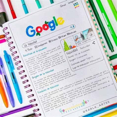 an open google page with markers, pens and pencils next to it on a desk