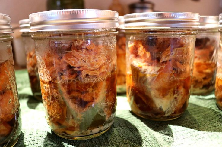 several jars filled with food sitting on top of a table