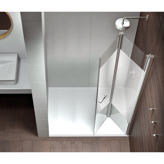 an overhead view of a bathroom with a glass shower door and wooden flooring on the walls