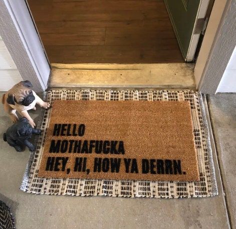 a door mat that says hello mohafuka hey, now ya dern