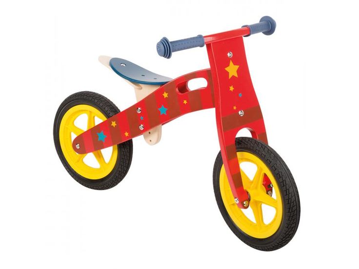 a wooden tricycle with yellow wheels and stars on it