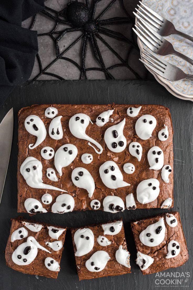 halloween brownies decorated with white icing and ghost faces