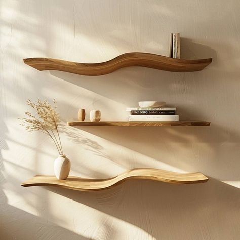 two wooden shelves with books and vases on them in the corner of a room