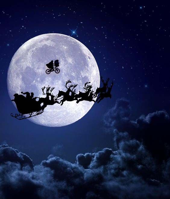 santa's sleigh flying in front of the moon with reindeers on it