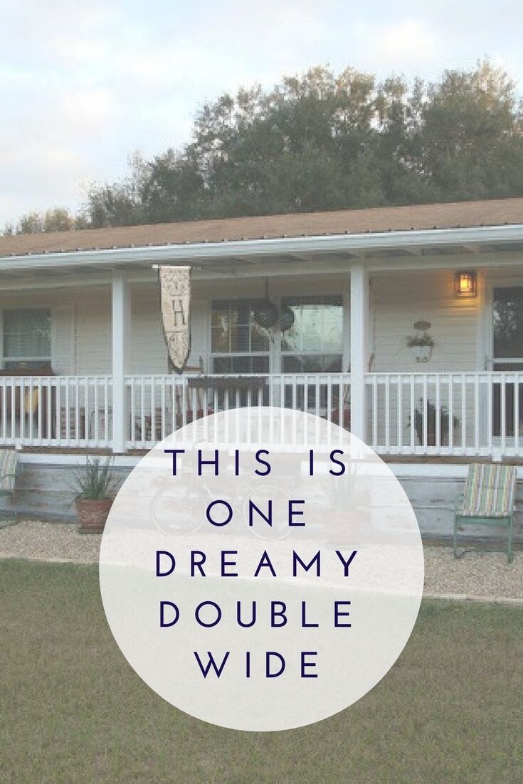 a white house with the words this is one dreamy double wide