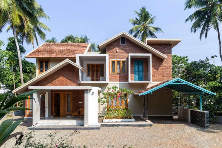 a house that is surrounded by palm trees