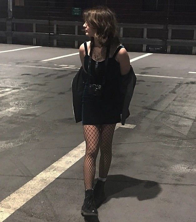 tight dark dress and boots on a roof Club Outfits Fishnets, Grunge Outfits Fishnets, Summer Fishnet Outfit, Fishnets With Dress, Fishnets With Skirt, Casual Fishnet Outfit, Fish Net Tights Outfit Dresses, Skirt And Fishnets Outfit, Shorts And Fishnets Outfits