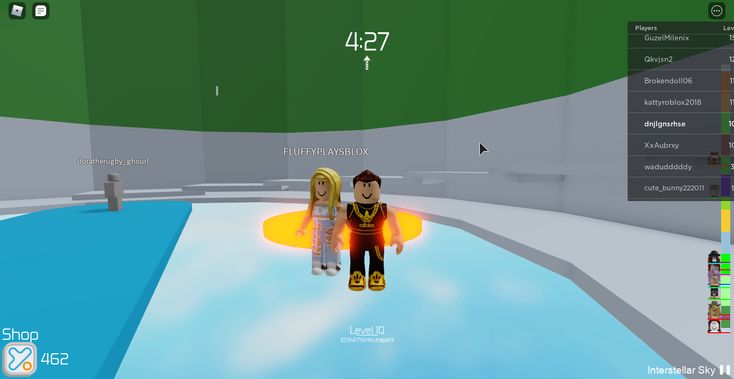 two people standing next to each other near a pool