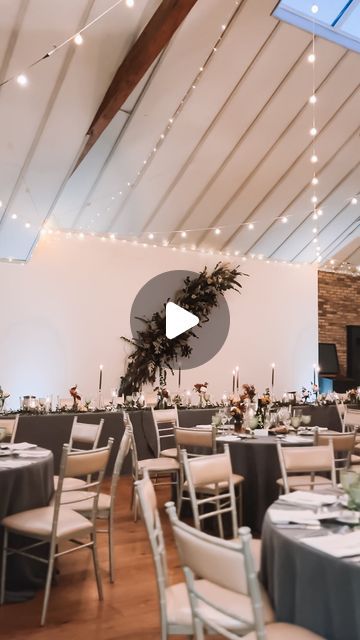 the inside of a wedding reception room with tables and chairs set up for an event