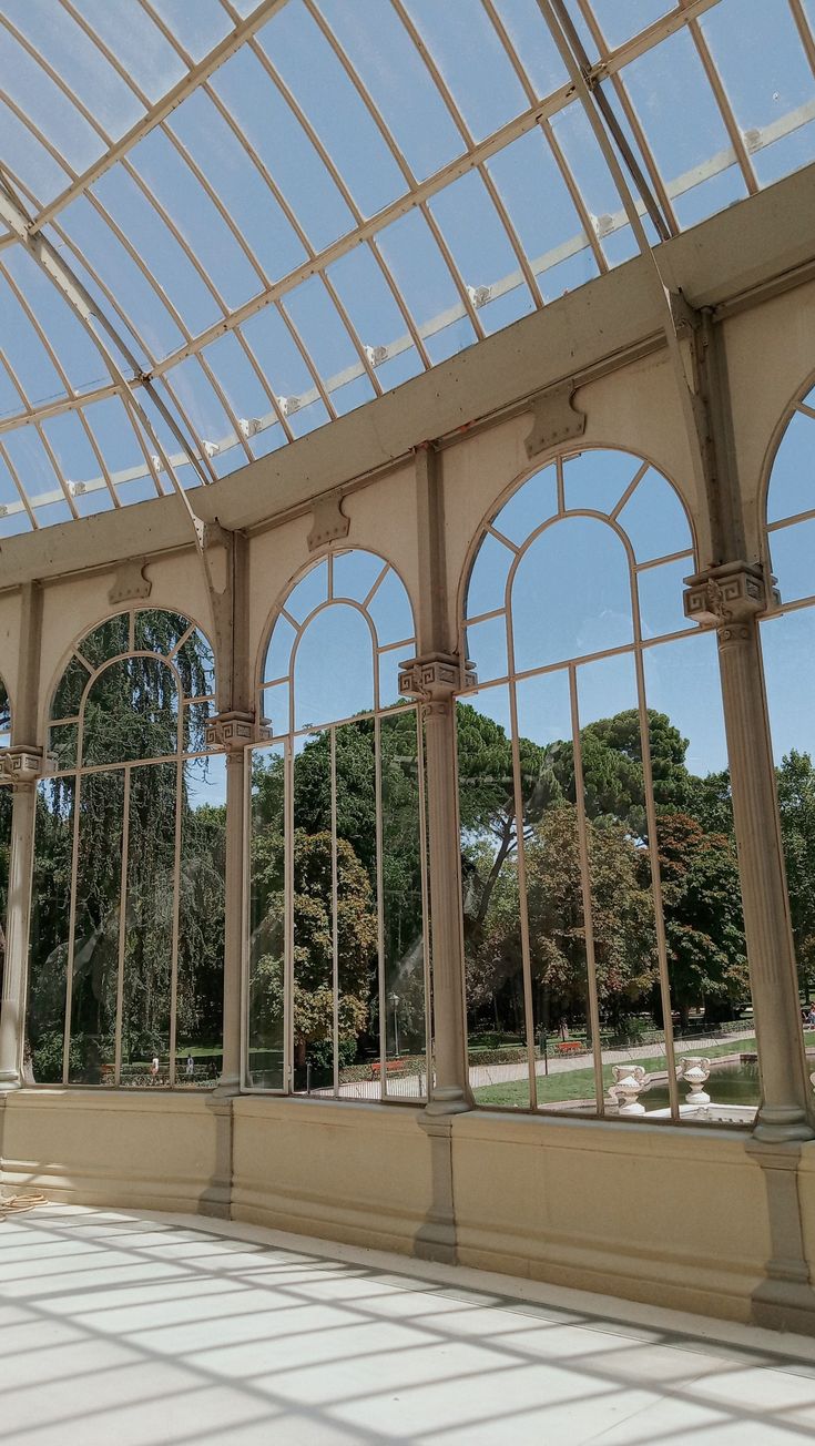 the inside of a large building with many windows and arches on it's sides