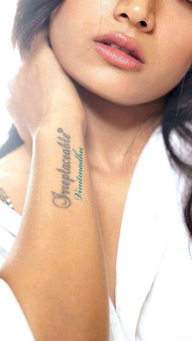 a woman with a tattoo on her arm