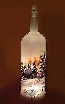 a glass bottle with a painting on it