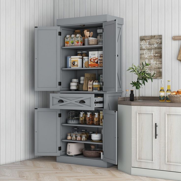 an open cabinet in the middle of a kitchen with lots of food on it's shelves