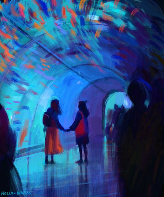 two people holding hands in a colorful tunnel