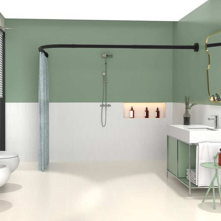 a bathroom with green walls and white floors