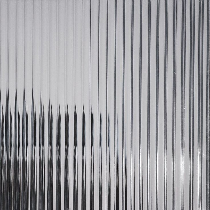 an abstract photograph of vertical lines in grey and white