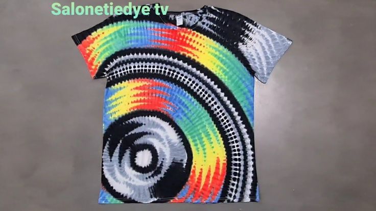 a colorful t - shirt with an abstract design on it