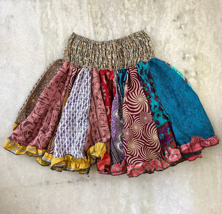 Handmade in Nepal Bohemian Patchwork Skirt For Festival, Bohemian Patchwork Denim Skirt, Bohemian Patchwork Skirt, Bohemian Festival Skirt With Patchwork, Hippie Tiered Skirt With Boho Print, Bohemian Floral Patchwork Skirt For Festival, Boho Print Tiered Hippie Skirt, Hippie Style Tiered Patchwork Skirt, Bohemian Cotton Skirt