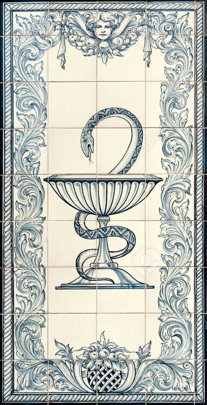 an ornate blue and white tile with a snake on it