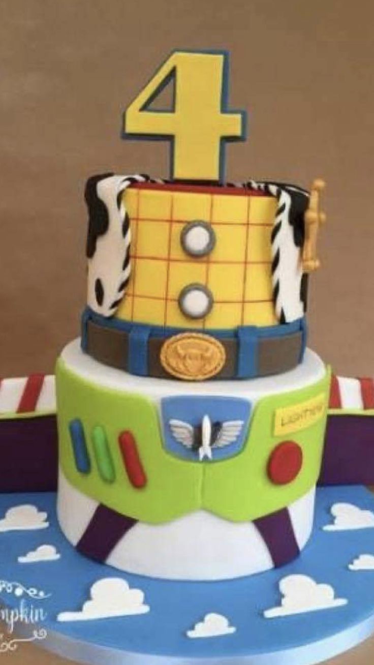 a birthday cake made to look like a toy story plane with the number four on top