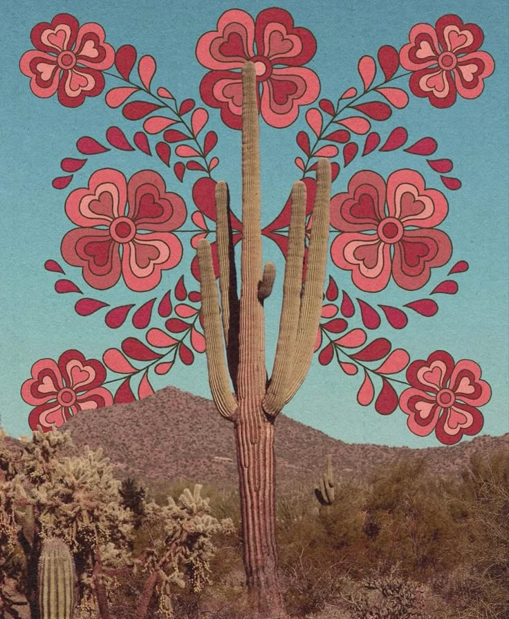 a large cactus with red flowers on it's back and blue sky in the background