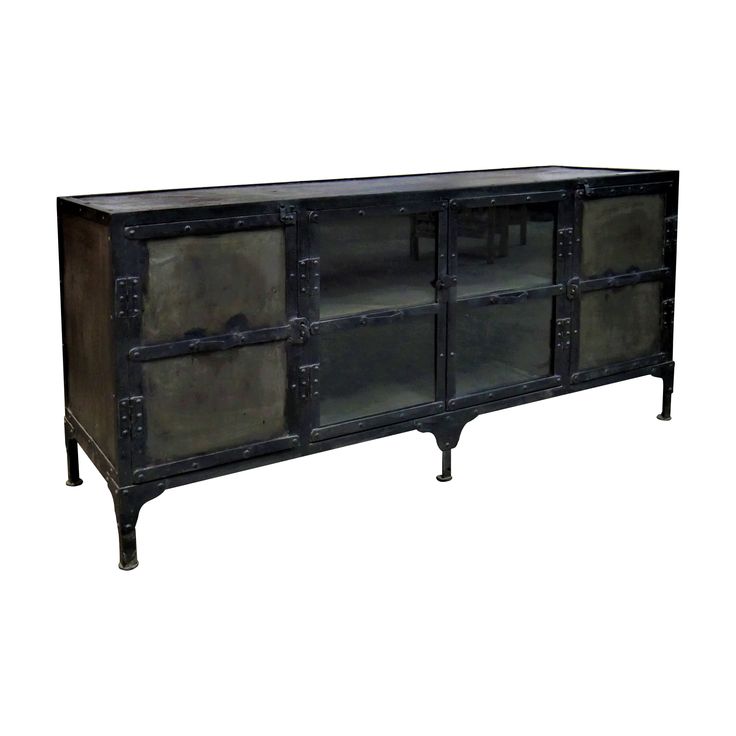 an old fashioned metal and glass sideboard with two doors on the bottom, one door open