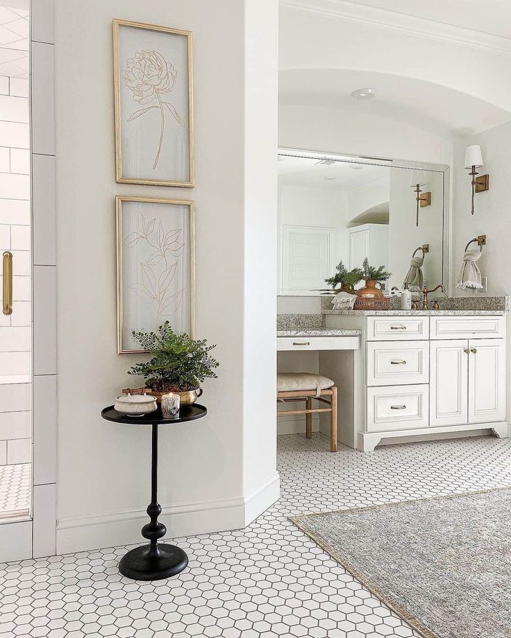 a bathroom with white walls and tile flooring