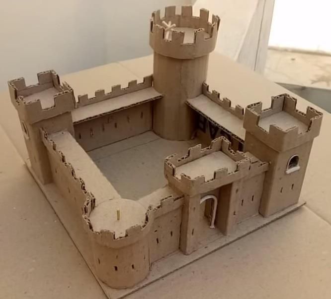 a castle made out of cardboard sitting on top of a table