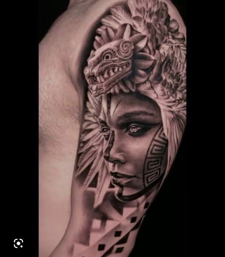 a man's arm with tattoos on it and an image of a woman wearing a headdress