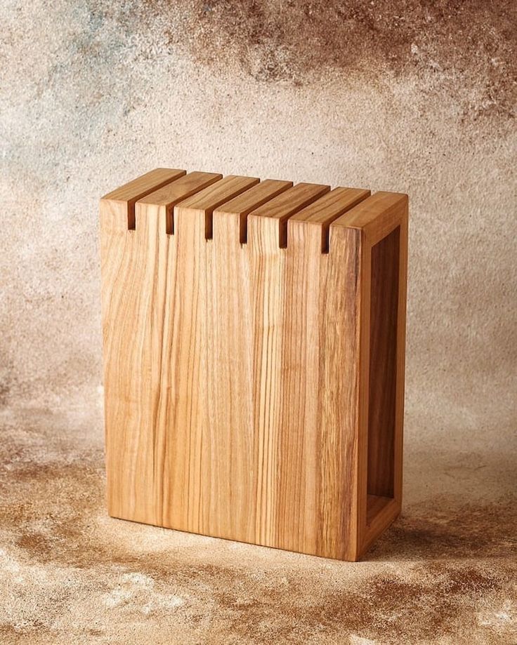 a wooden block sitting on top of a table