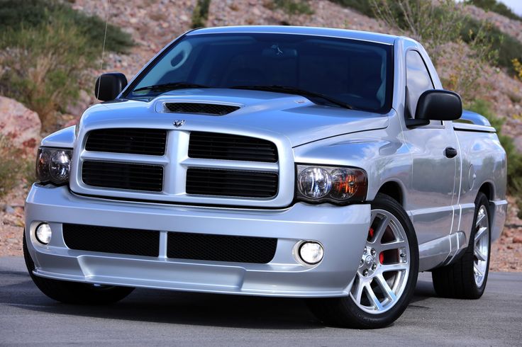 the front end of a silver dodge truck