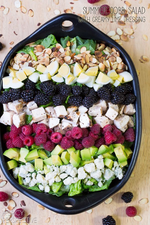 a bowl filled with fruit and nuts on top of a table