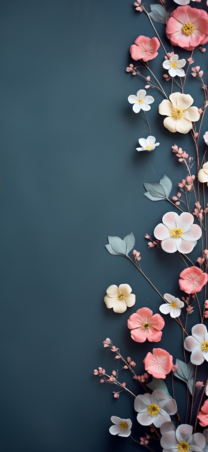 an arrangement of flowers on a black background