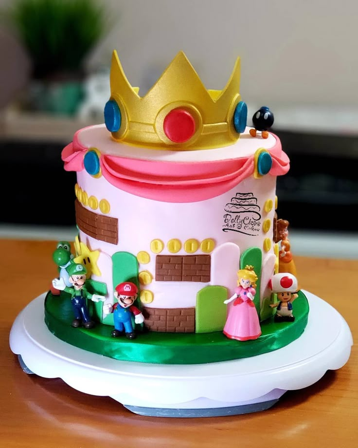 a cake with mario and princess peaches on it sitting on top of a table