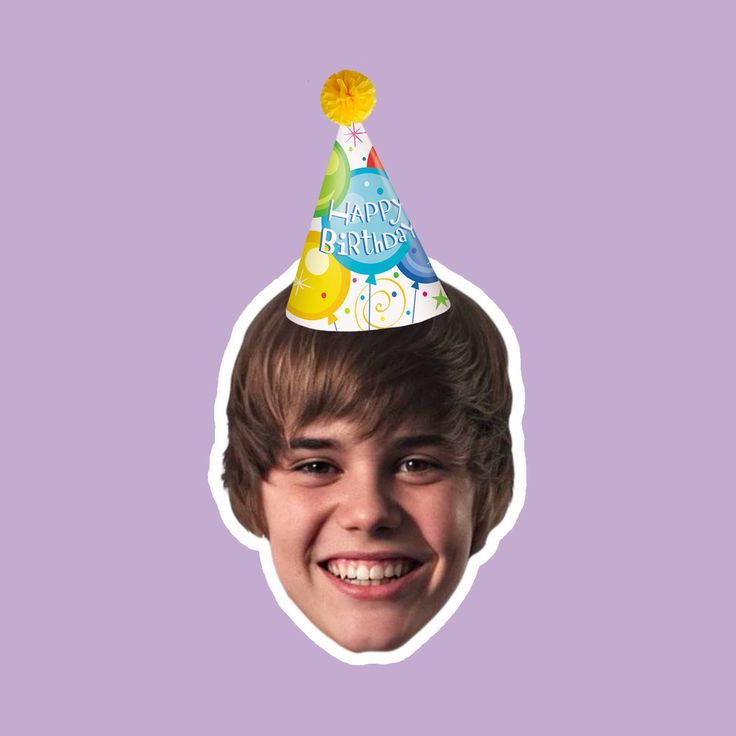 a young boy wearing a birthday hat with the words happy birthday on it's face