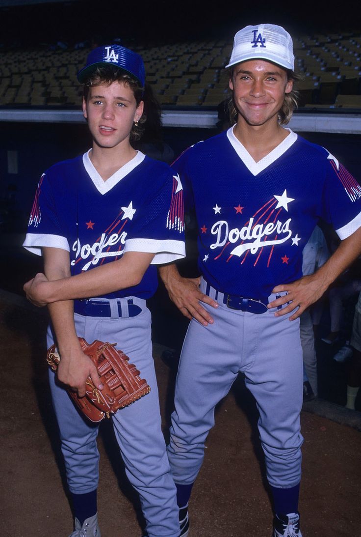 two baseball players standing next to each other