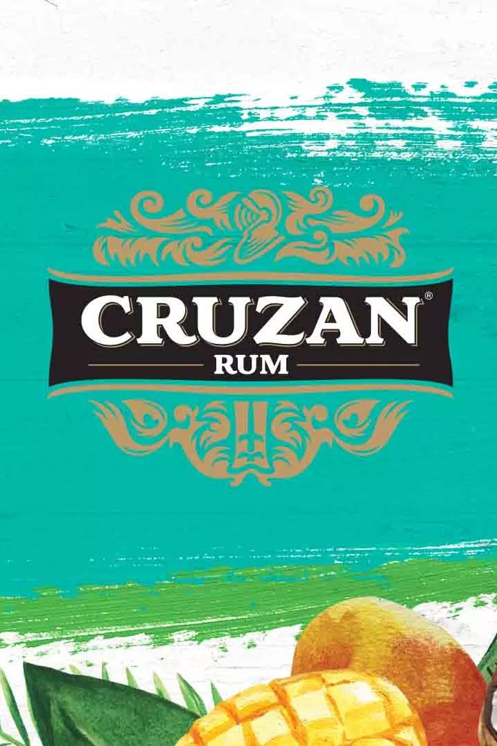 an advertisement for cruzan rum with oranges and leaves on the front cover